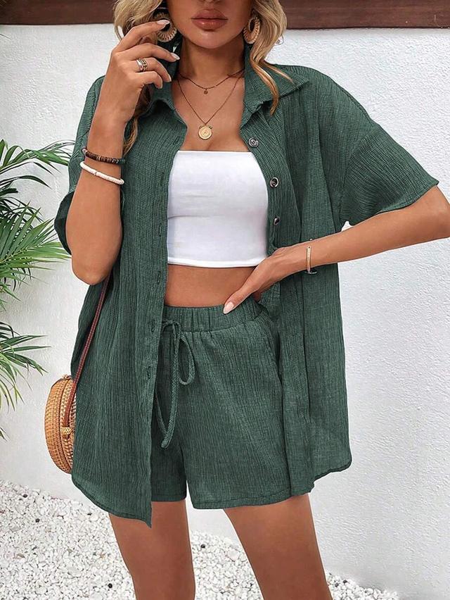green textured button down blouse and tie shorts set