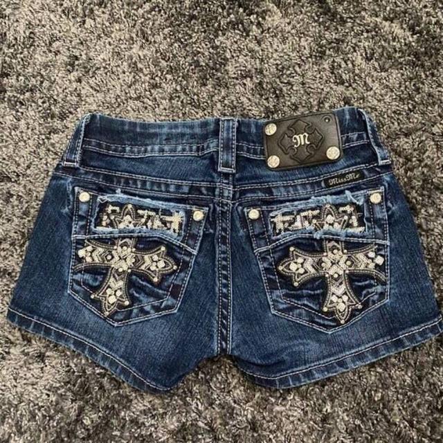 blue embellished dark wash denim shorts with cross detail