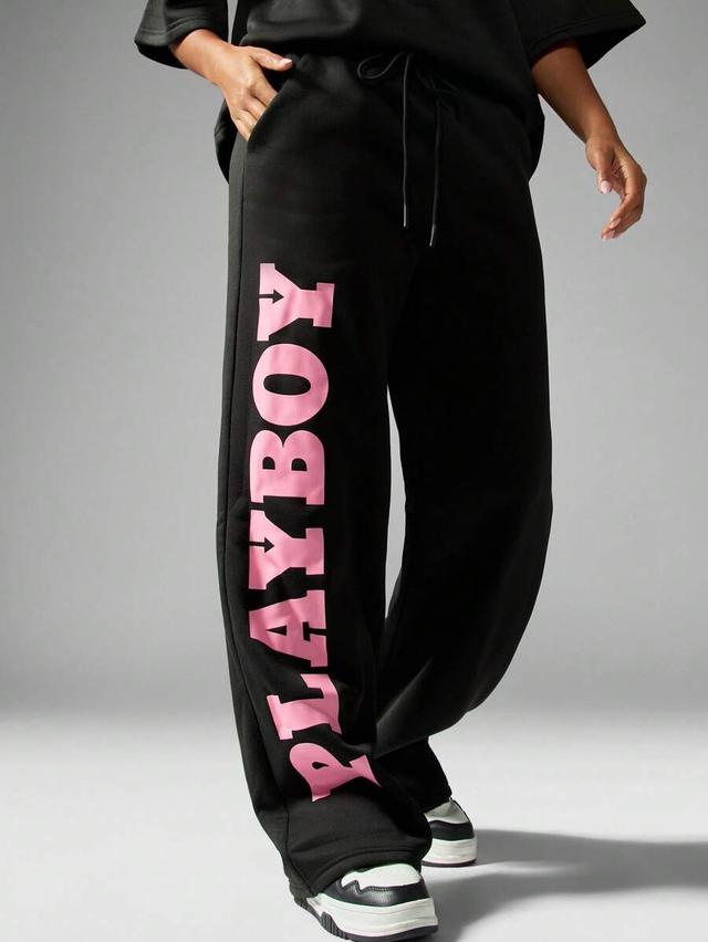 black oversized wide leg sweatpants with pink logo