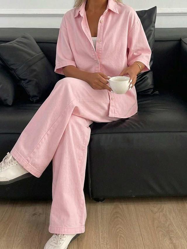 pastel pink short-sleeved button-up shirt and matching wide-leg trousers
