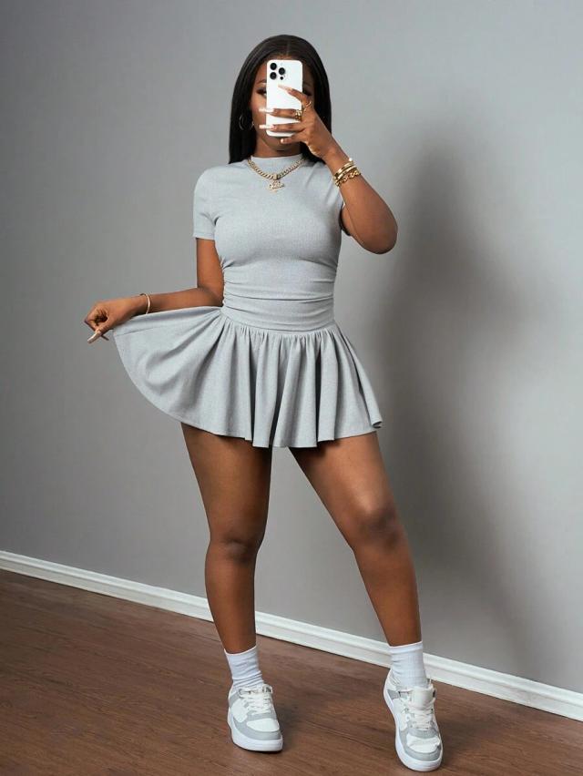 grey short sleeve crop top and pleated mini skirt
