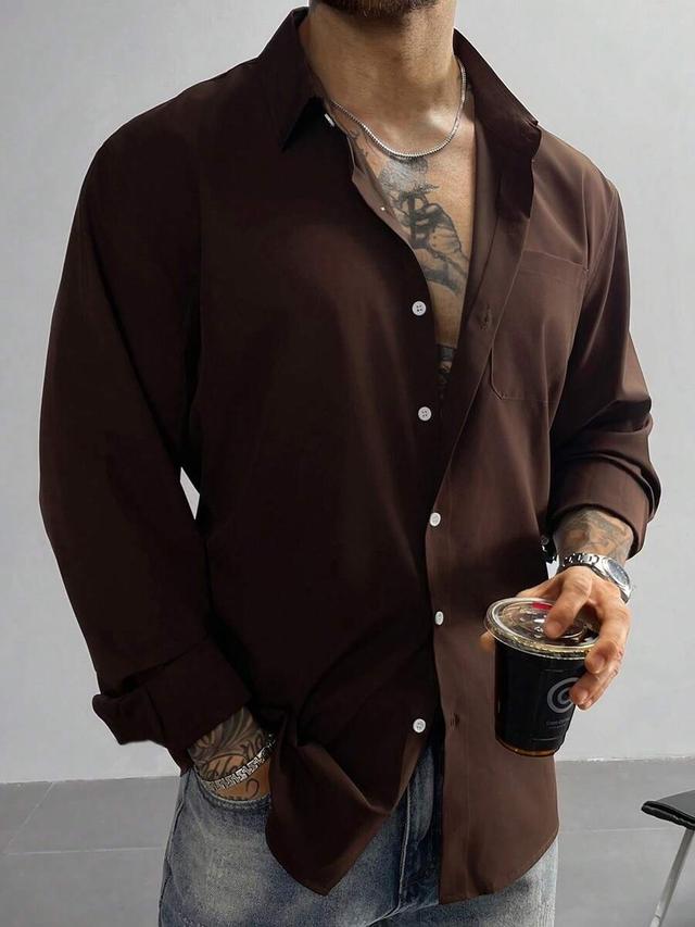 solid brown long sleeve button up dress shirt