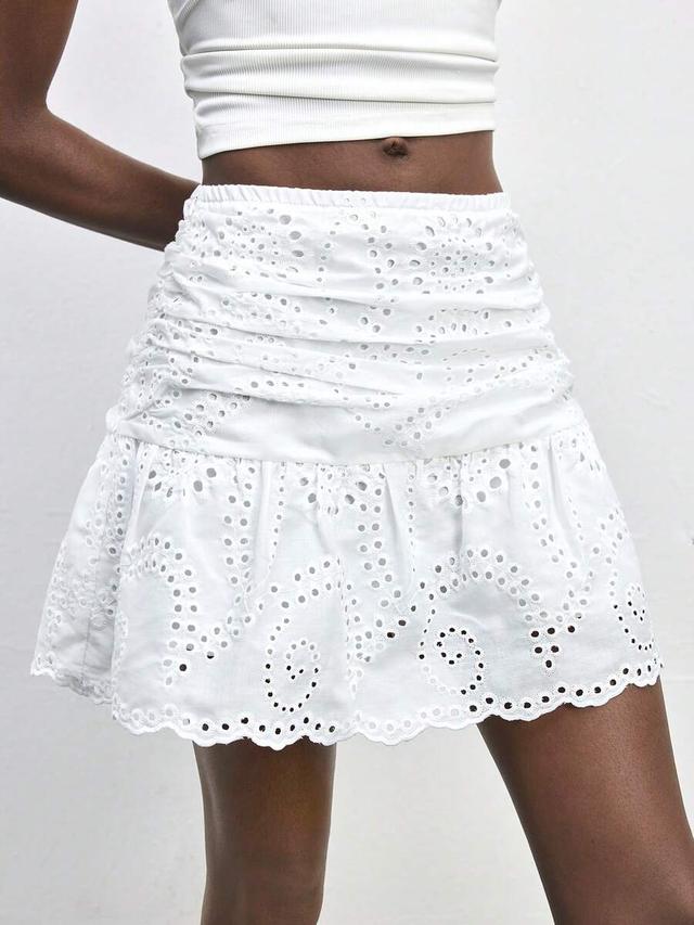 white schiffli eyelet low waist ruffle hem skirt