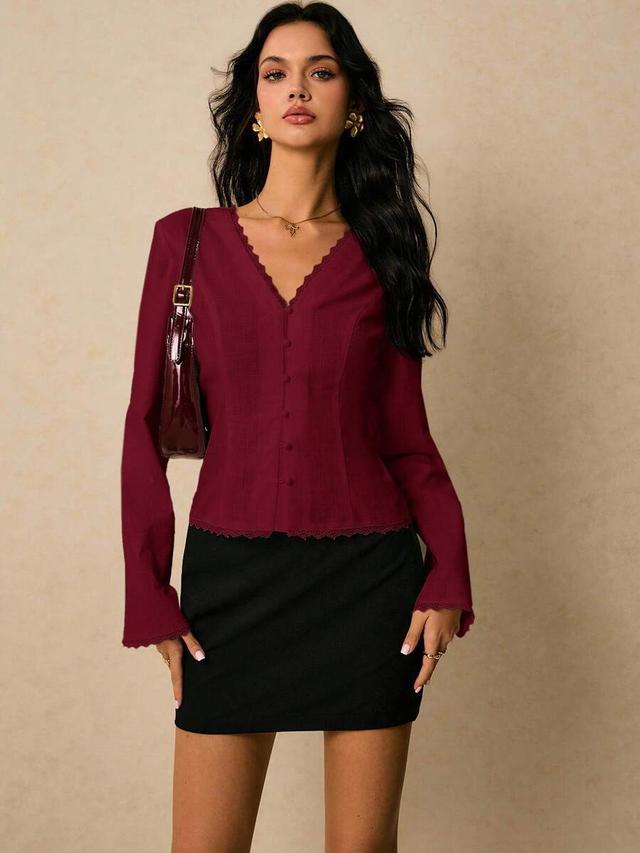 burgundy cinched waist flare sleeve blouse