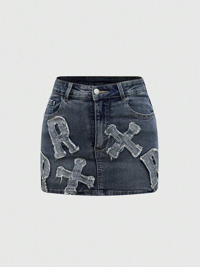 distressed denim mini skirt with raw edge applique
