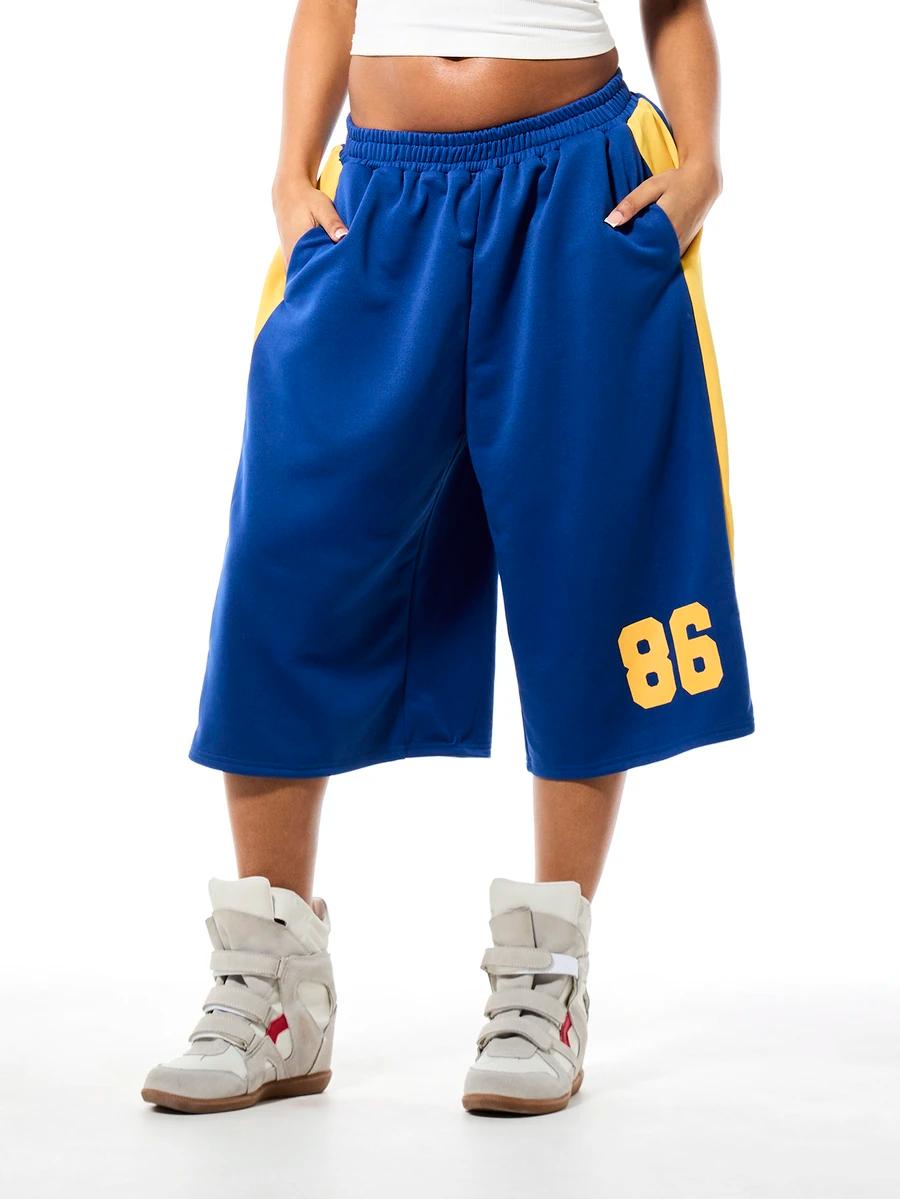 blue oversized basketball shorts with yellow side stripes