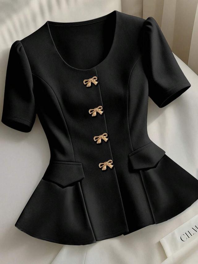 black short sleeve peplum blouse with gold bow buttons