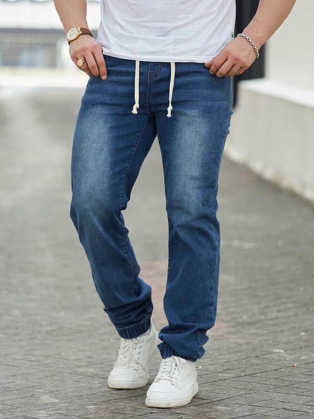 dark blue washed denim drawstring carrot jeans
