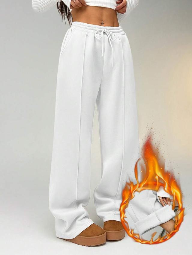 white straight leg sweatpants with seam detail