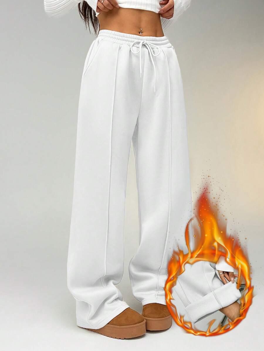 white straight leg sweatpants with seam detail