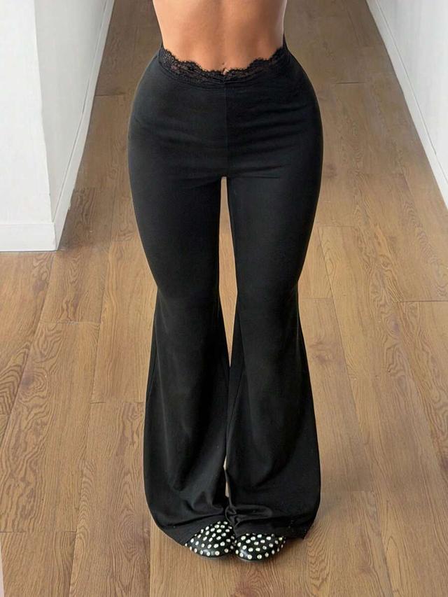 black high waisted lace trim bell bottom trousers