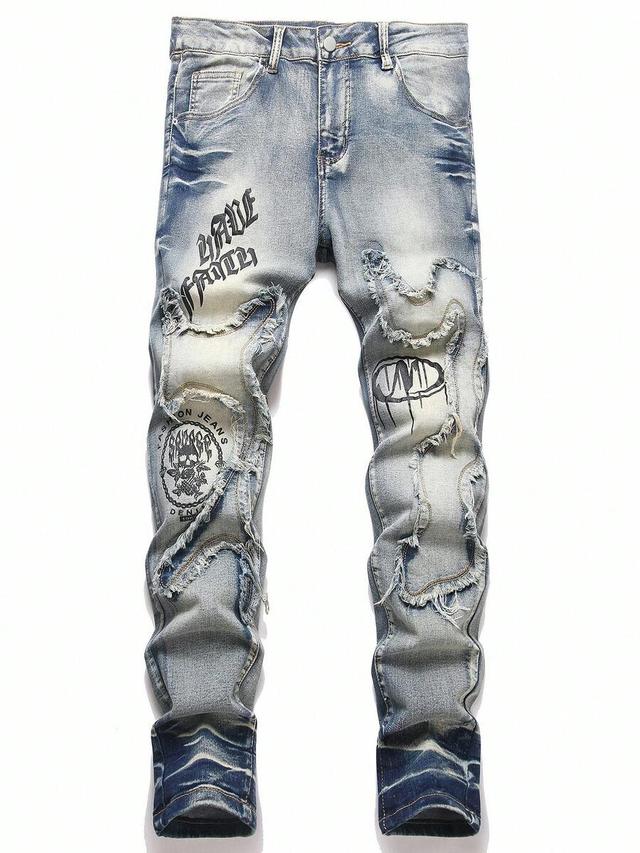 distressed light wash denim jeans with graphic print
