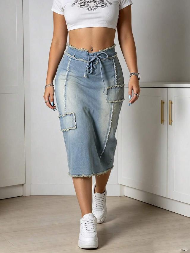 light wash denim midi skirt with frayed patchwork details