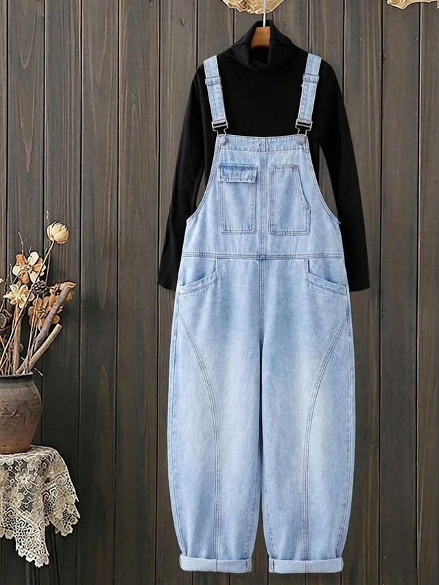 light wash denim dungarees with curved paneling