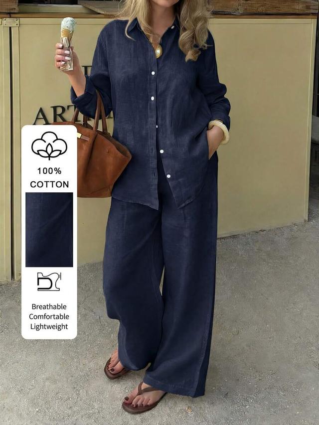 navy blue cotton collared long sleeve button down shirt