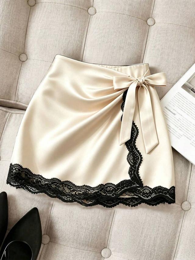 beige satin mini skirt with black lace trim