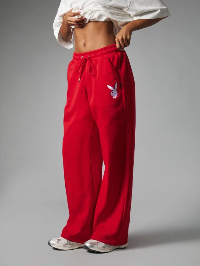 red wide leg fleece sweatpants with playboy logo