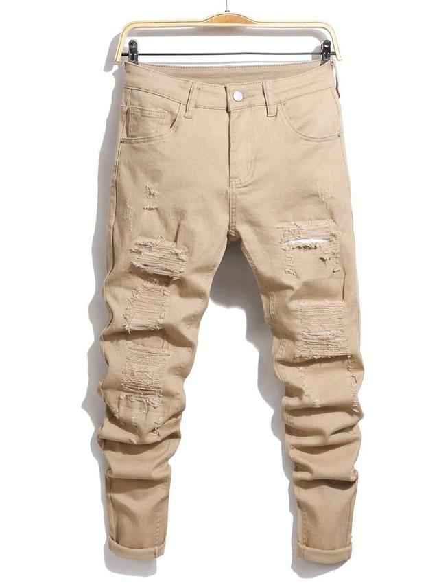 men's beige loose fit distressed denim jeans