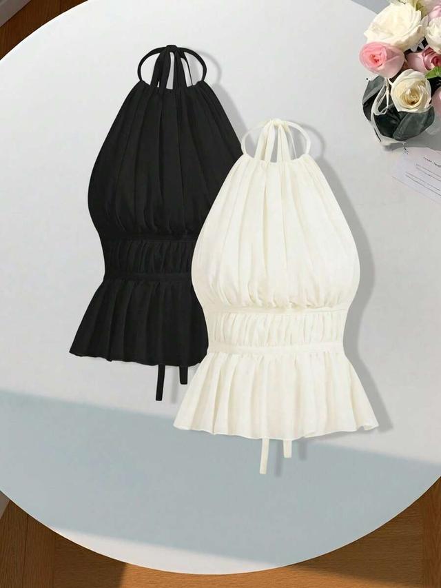 white two pleated halter neck top in black and white