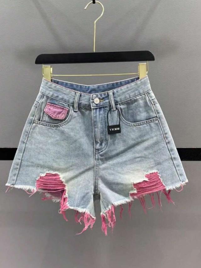 light wash denim shorts with pink distressed detailing