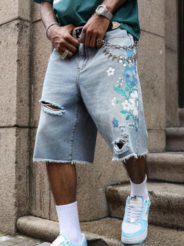 light wash ripped denim bermuda shorts with floral graphic