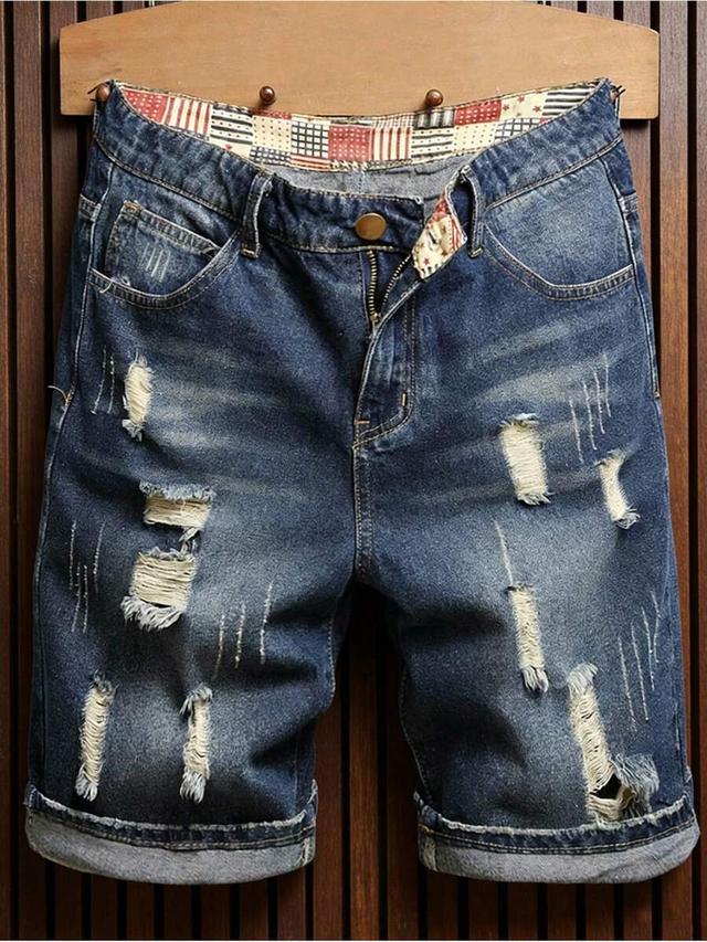 blue ripped denim knee-length shorts