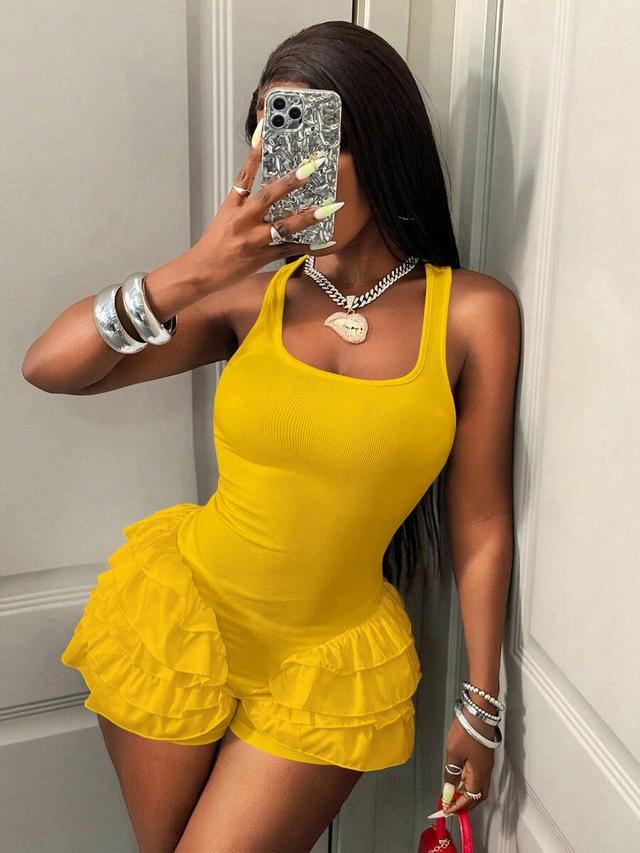yellow ribbed tank playsuit with layered ruffle hem