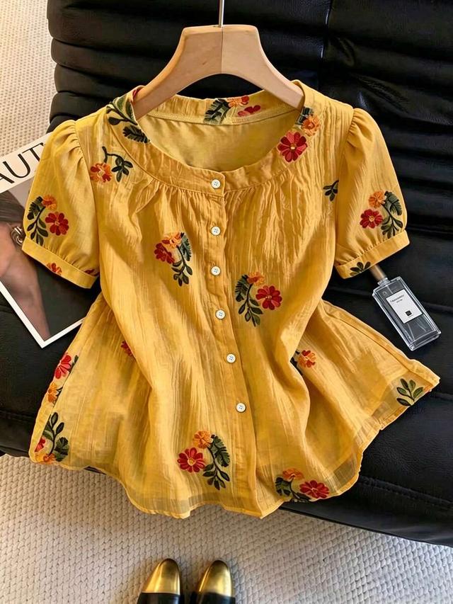 yellow textured floral embroidered round neck blouse