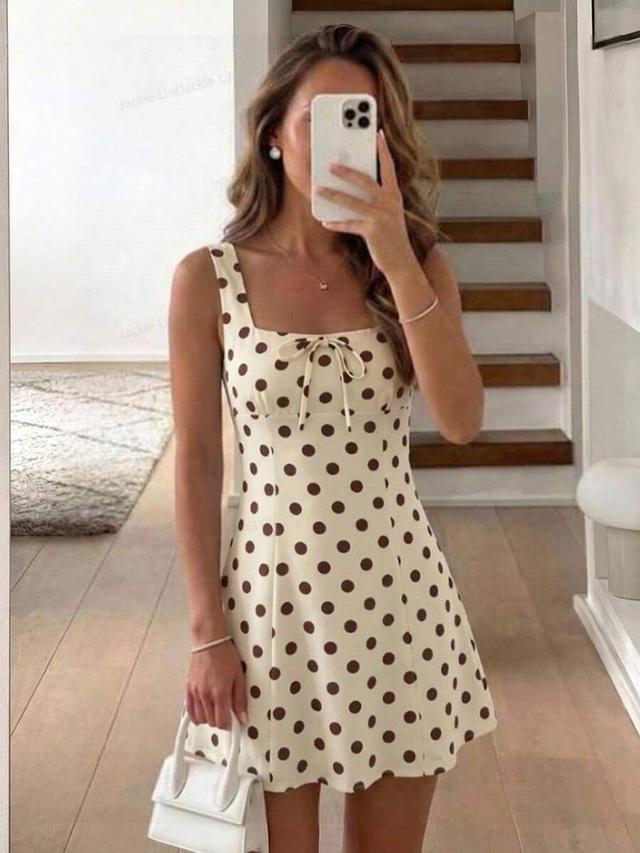 pale yellow polka dot sleeveless mini dress
