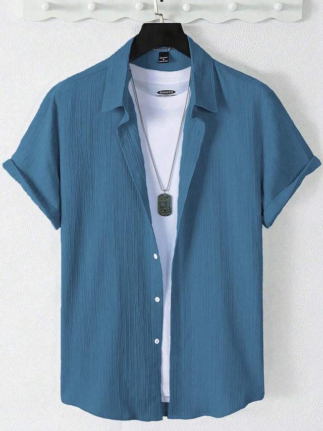 blue textured short sleeve casual button-up shirt