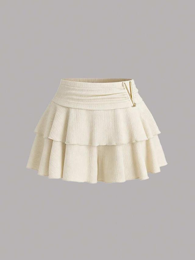 textured beige ruffled minimalist skort with metal decor