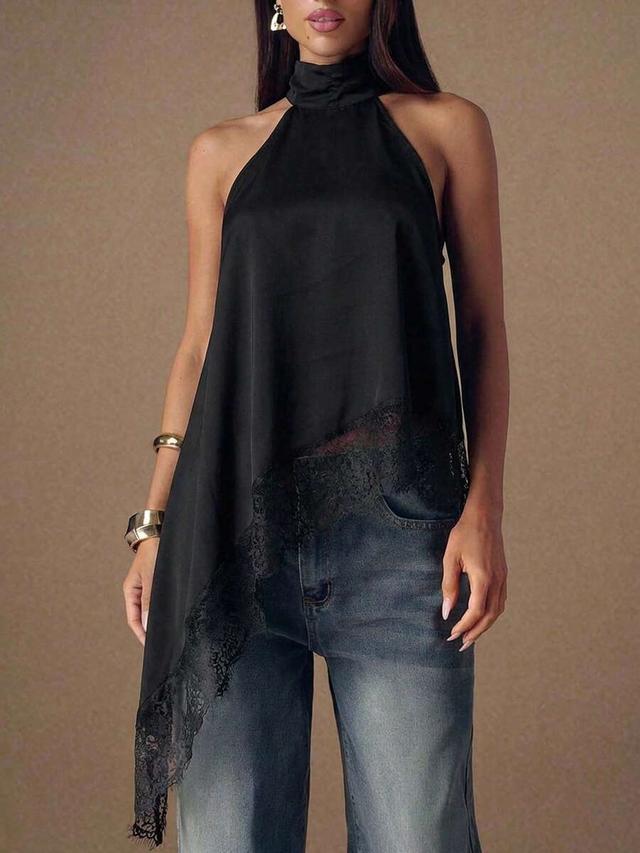 black asymmetrical halter neck top with lace patchwork