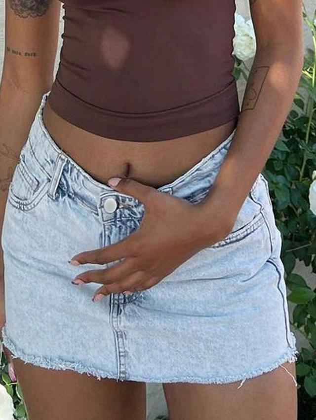 vintage light wash denim mini skirt with raw hem