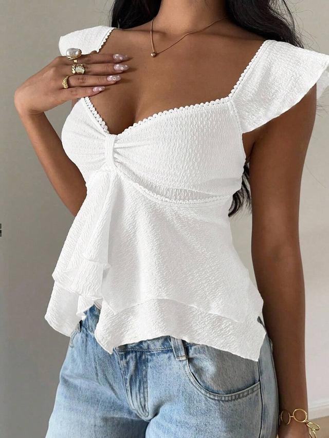 white textured knit sweetheart neck ruffle hem top