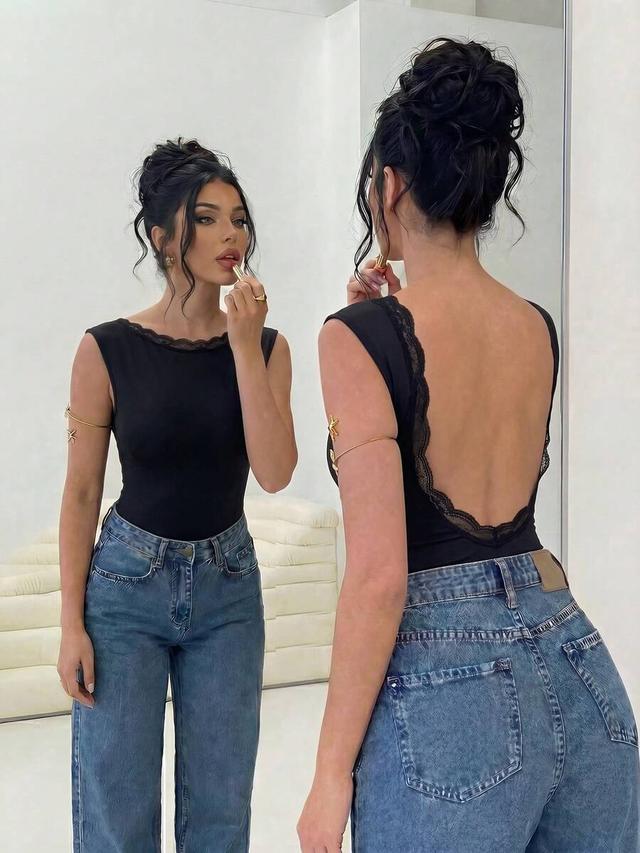 elegant black backless bodysuit with lace trim