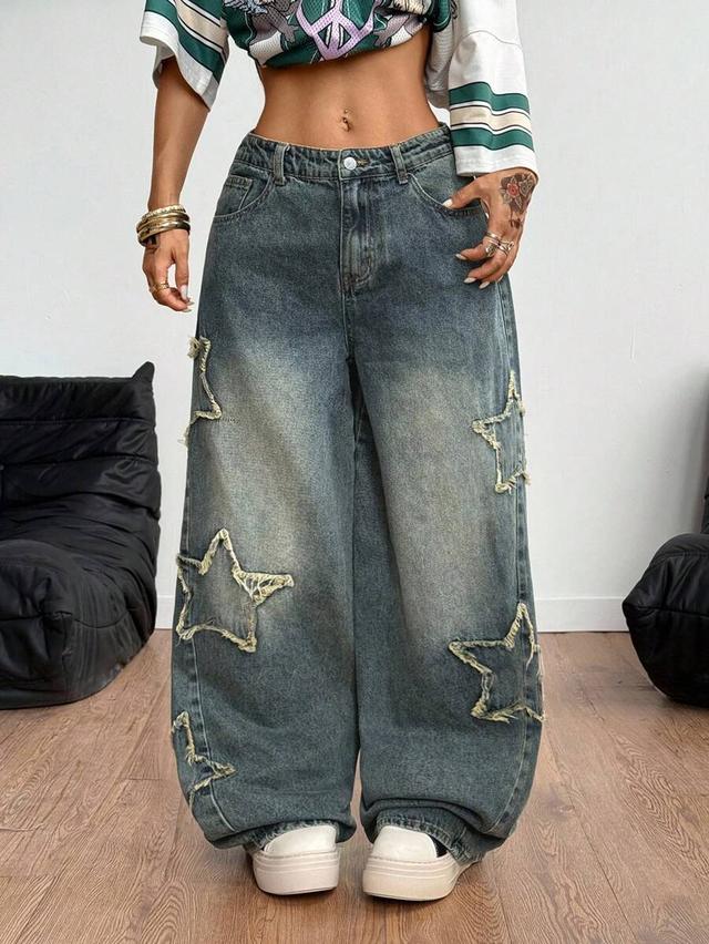 washed denim baggy jeans with frayed star patches