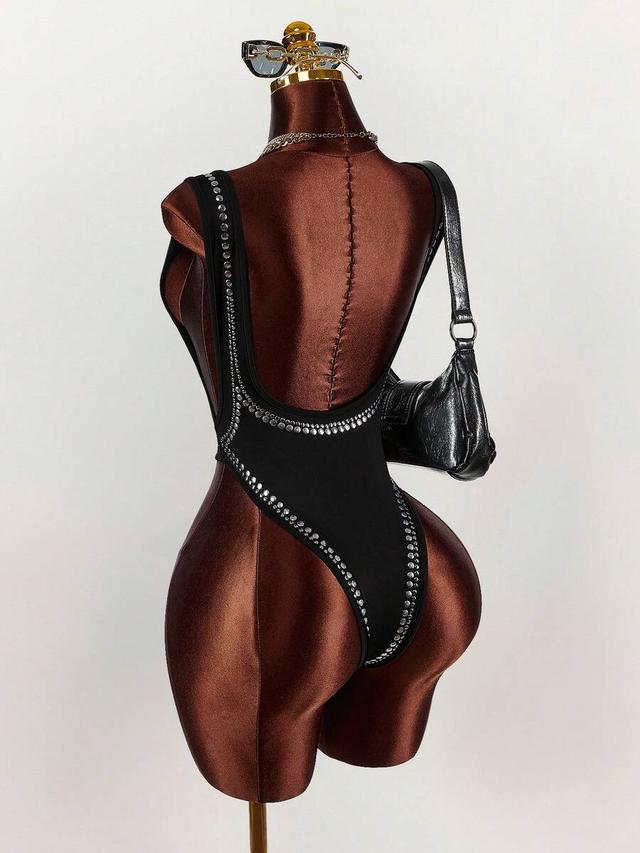 black sleeveless scoop neck bodysuit with studded rivet detail