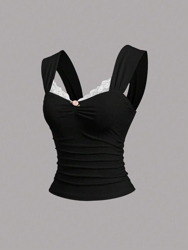 black fitted top with lace trim and ruched waist
