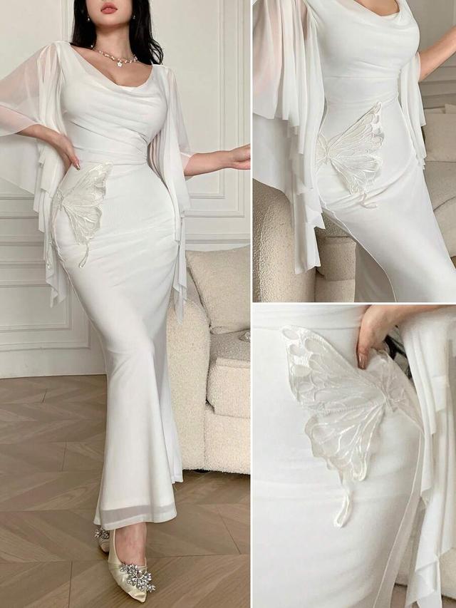 white elegant long dress with butterfly embroidery and ruffles