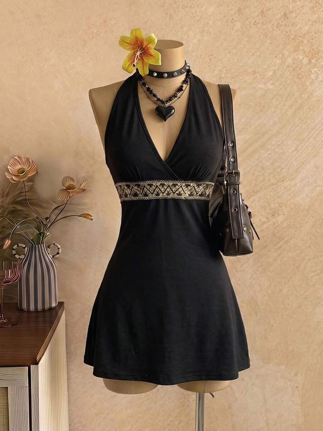 black v-neck halter dress with embroidered waist detail