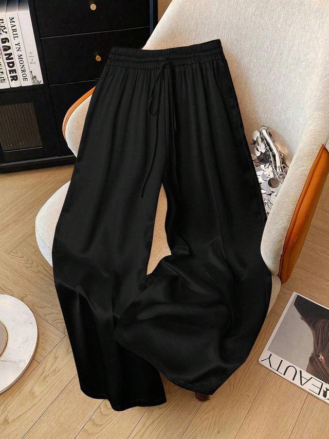 solid black woven drawstring waist wide leg pants