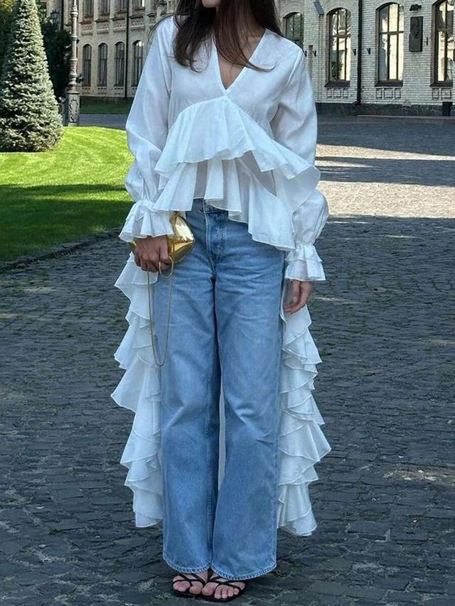 white v-neck long sleeve blouse with ruffled hem