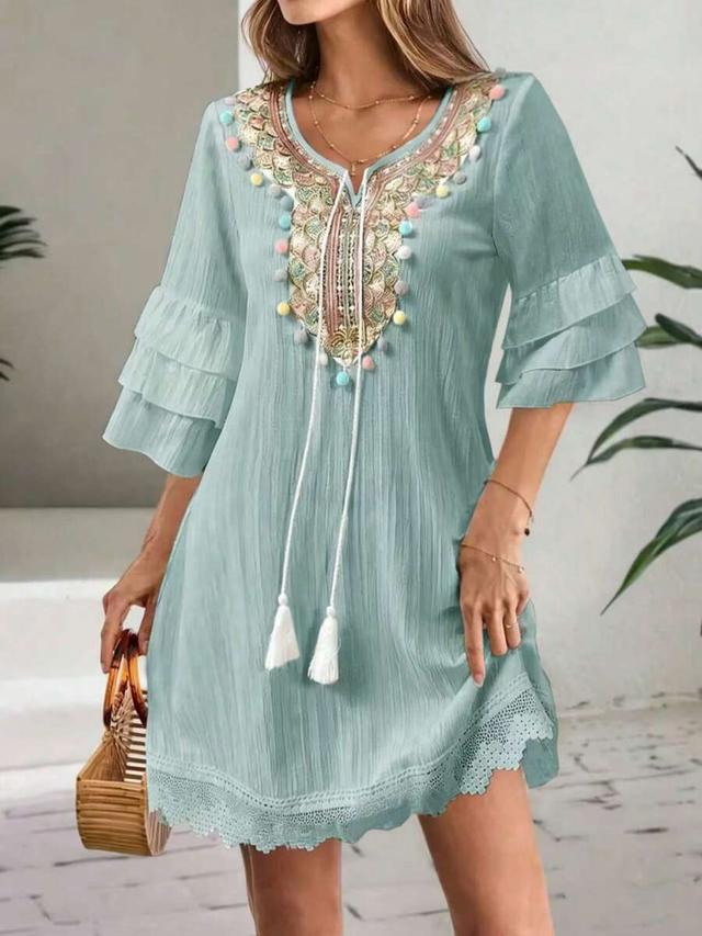 ladies embroidered v-neck dress with colorful tassel detail