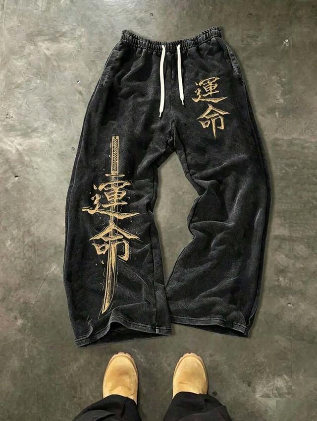 washed black wide leg sweatpants with samurai graphic