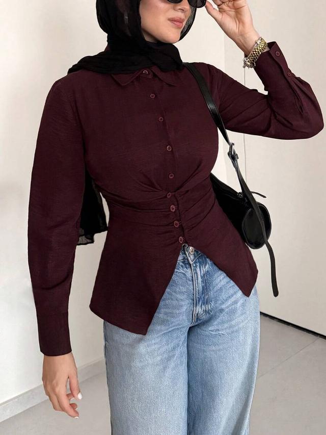 burgundy waist-cinching button-up blouse