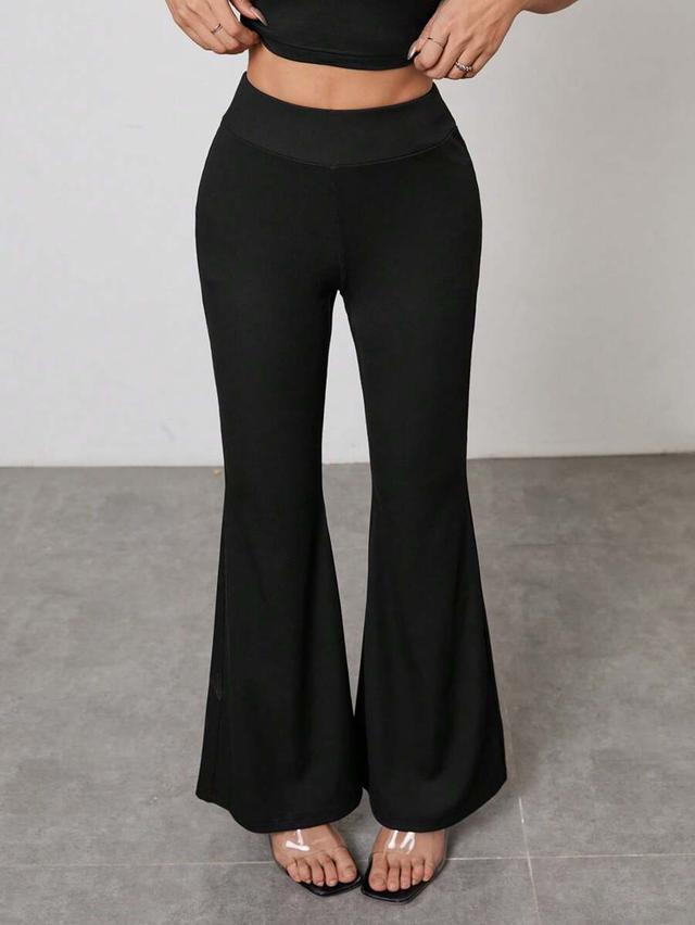 black high-waisted flared casual trousers