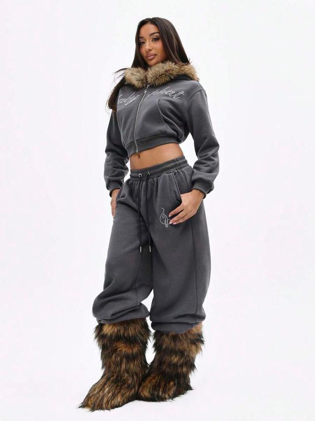 baggy charcoal joggers with rhinestone logo and fur trim