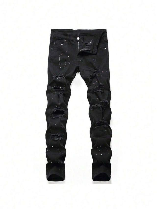 black slim fit ripped denim jeans with paint splatter