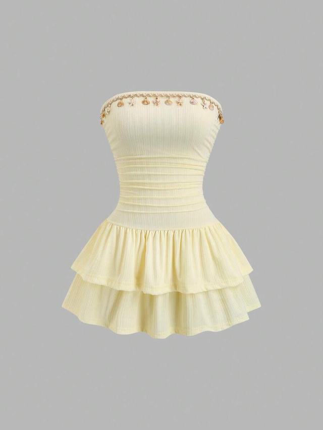 pale yellow strapless jacquard mini dress with ruffle hem