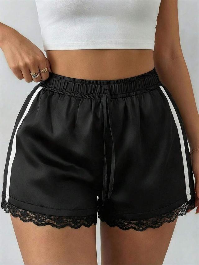 black satin athletic shorts with lace trim